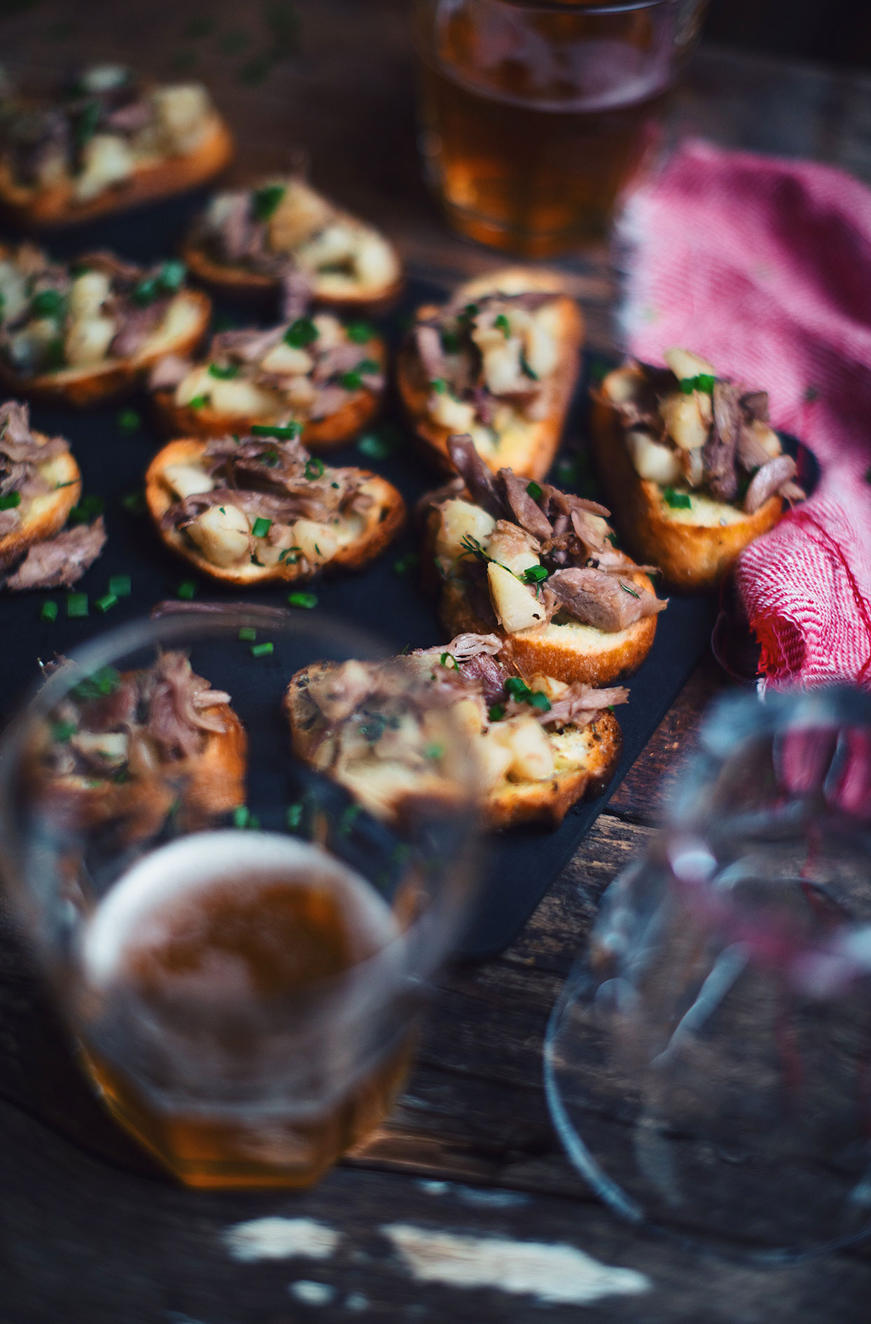 Duck confit with honey beer sautéed apples crostinis