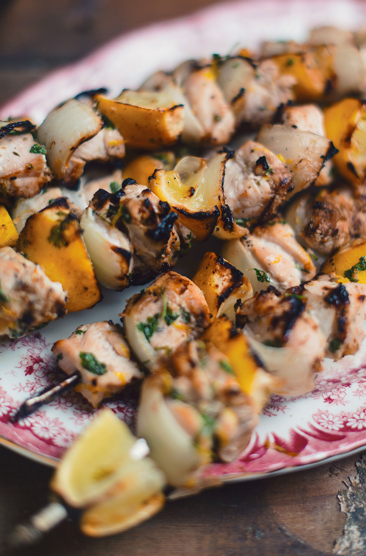 Chicken skewers with grilled lemons and Vidalia onions