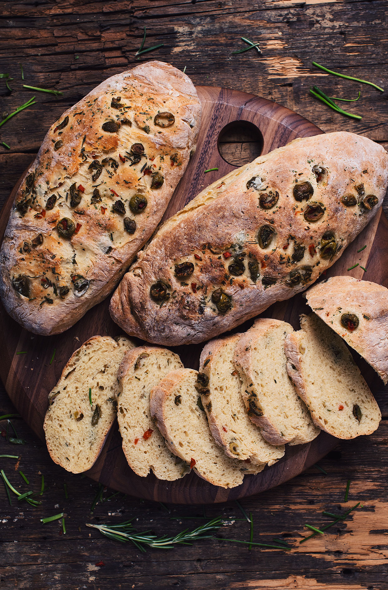Bread baguettes with olives, fresh herbs and beer