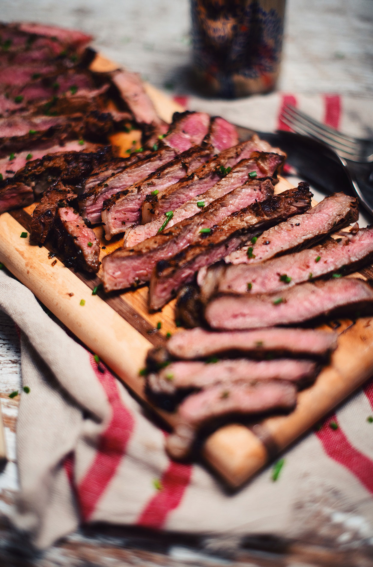Grilled strip loin steaks with apple cider marinade