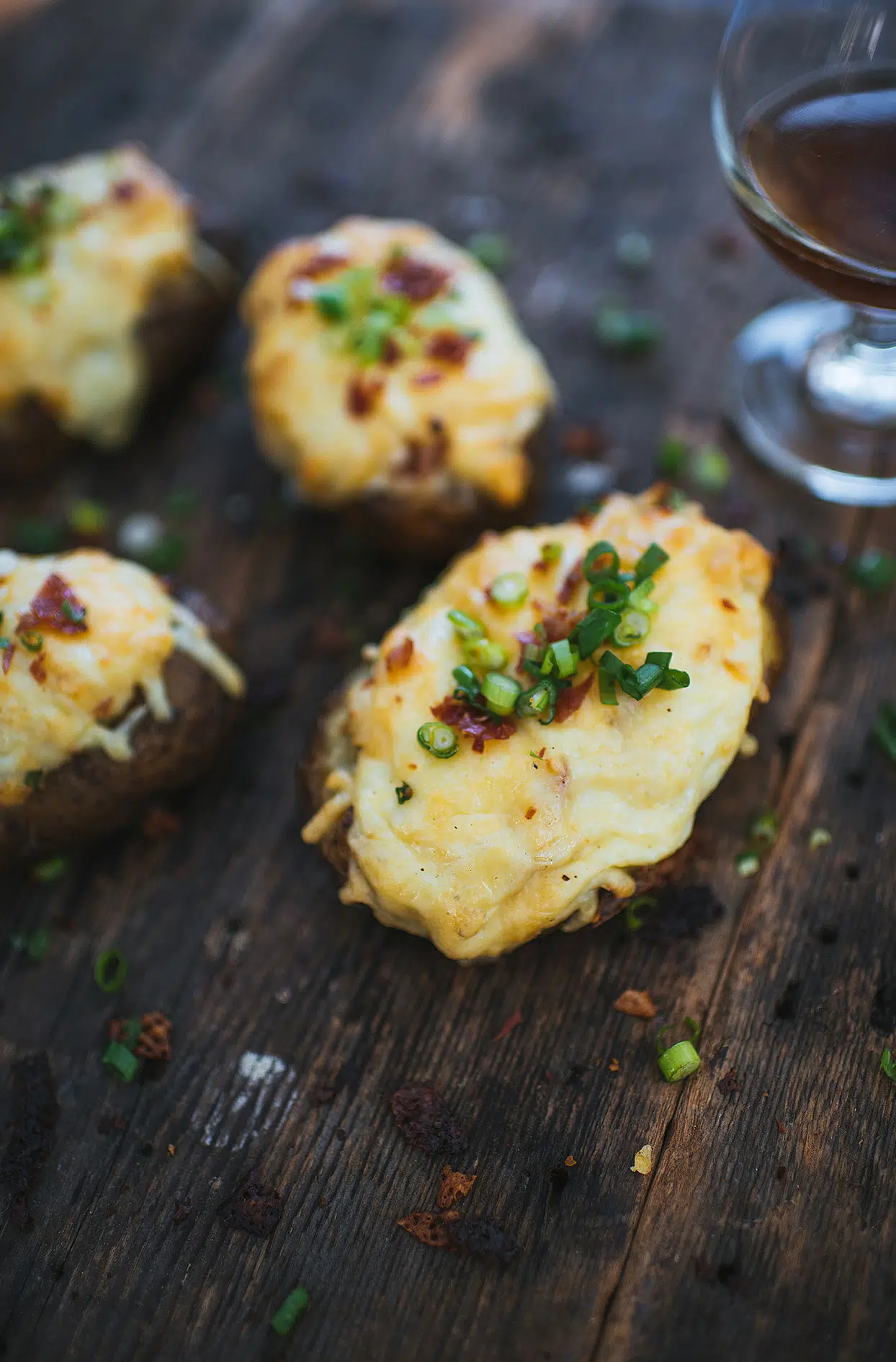 Smoked stuffed potatoes with sour cream, prosciutto, and cheese