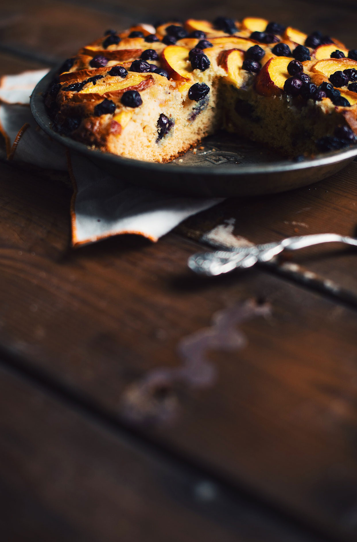 Blueberry cake with rum peaches