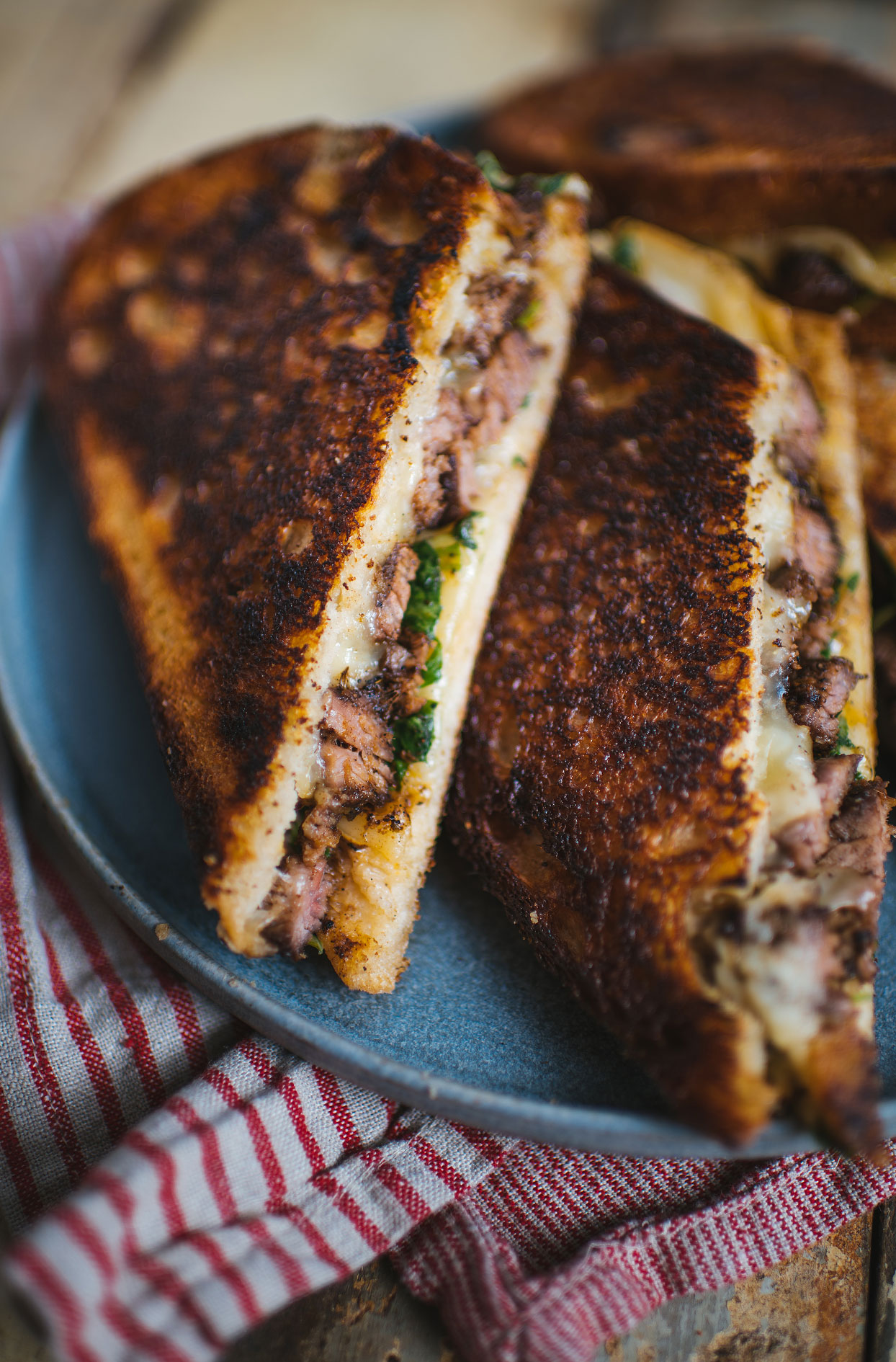 Flank steak grilled cheese with arugula, spicy mayo and raclette cheese