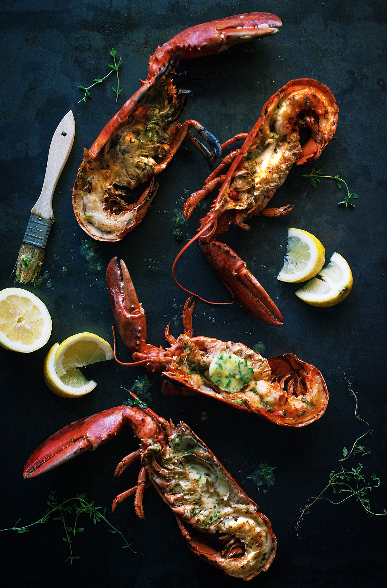 BBQ grilled lobsters with homemade lemon and fine herbs butter