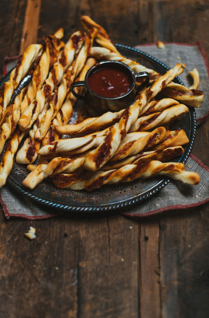 Cheese and prosciutto straws with homemade marinara dip