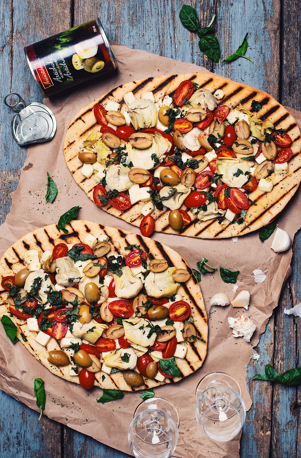 BBQ pizza with artichoke hearts, olives and Haloumi cheese