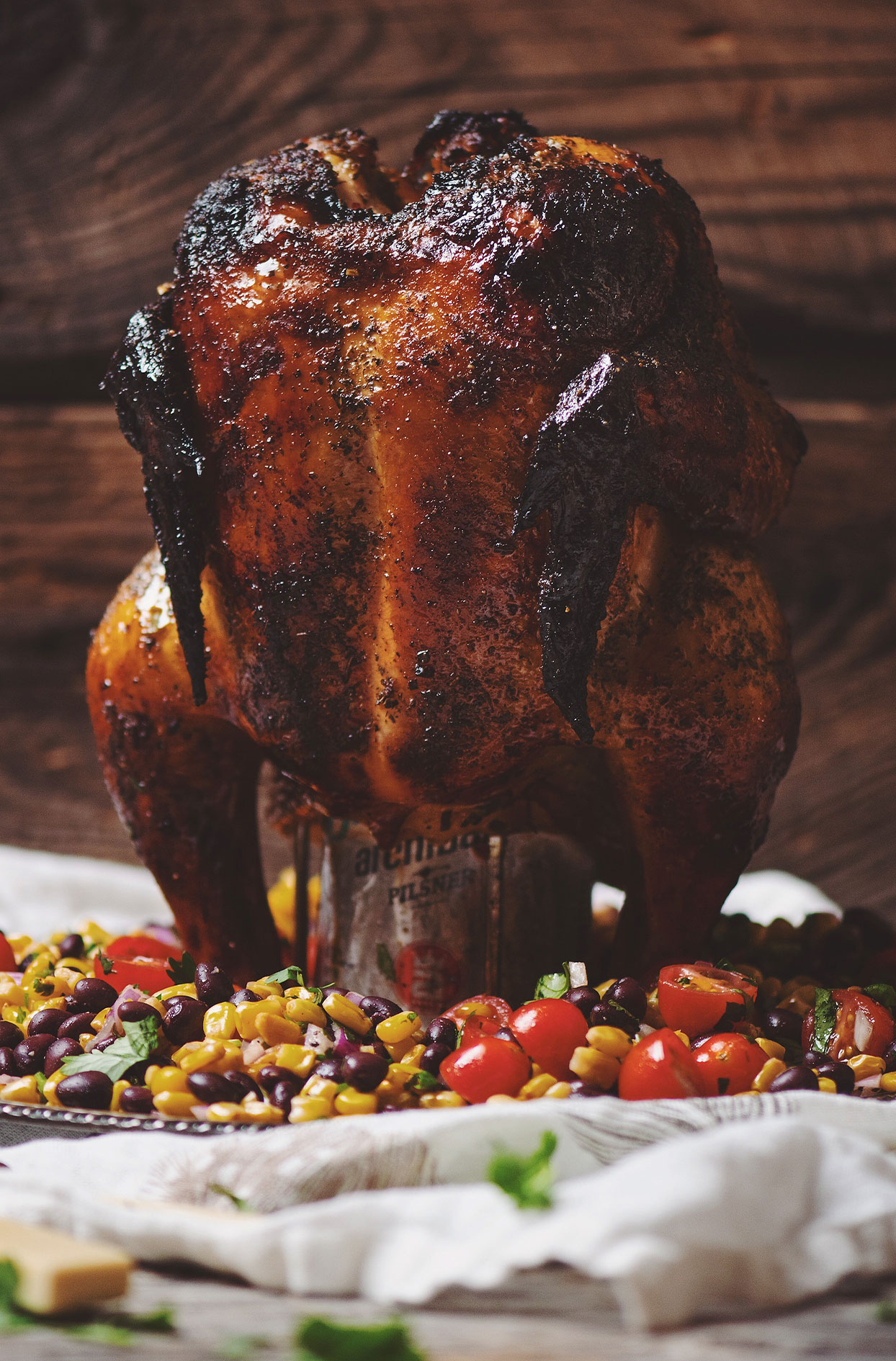 Lime and chili BBQ beer can chicken with corn salad