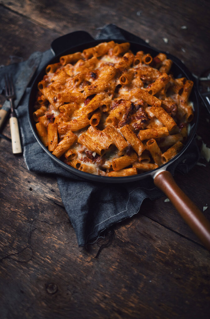 Rigatoni gratin with duck confit, grilled pancetta and tomato sauce