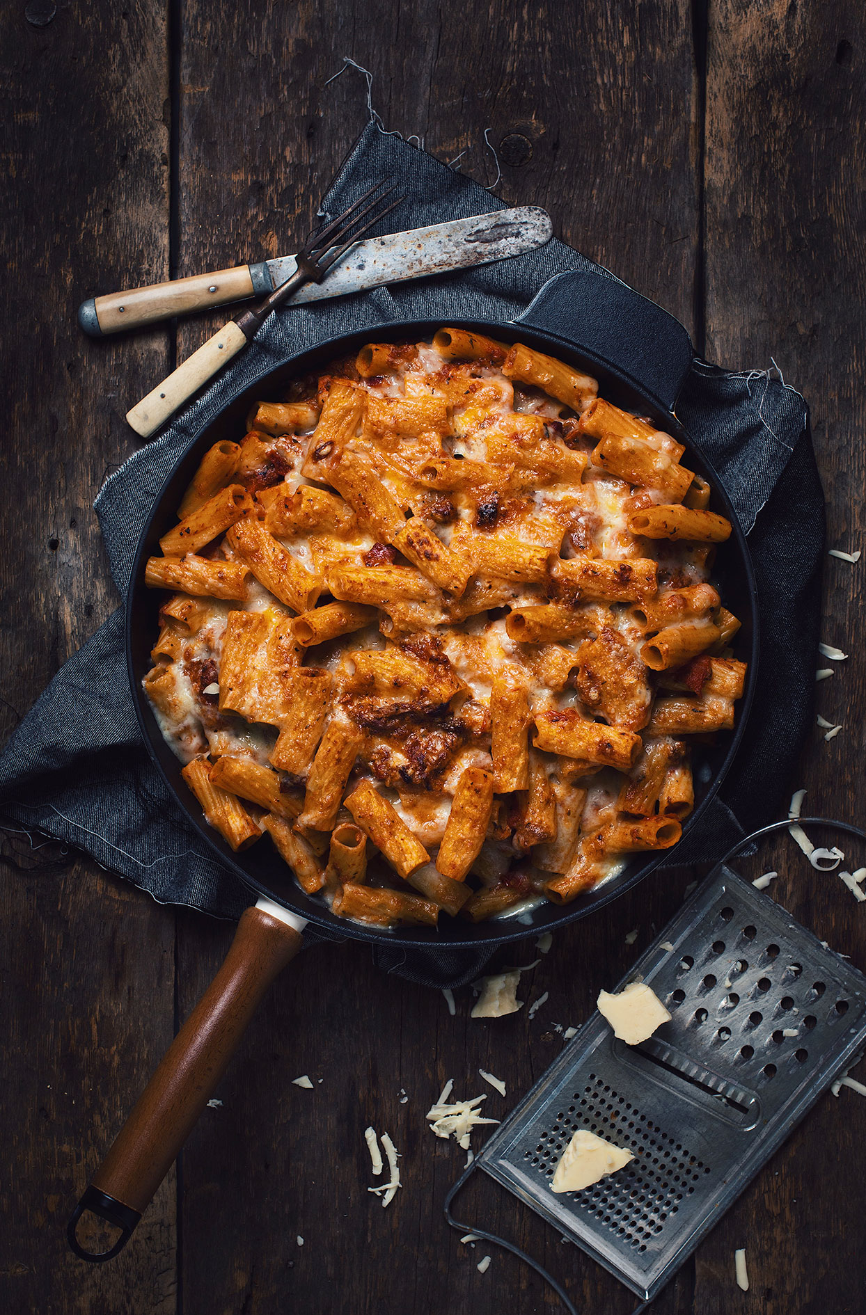 Rigatoni gratin with duck confit, grilled pancetta and tomato sauce
