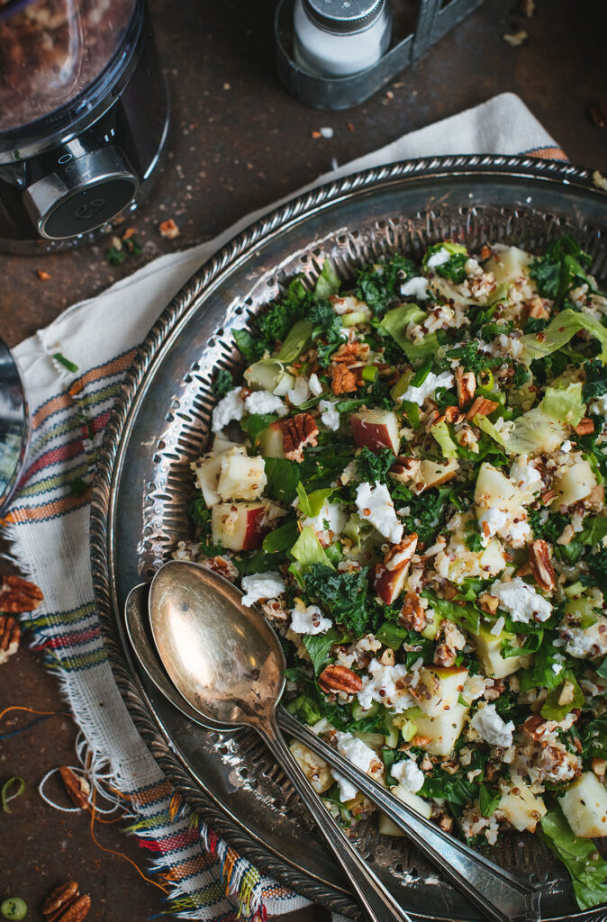 Kale salad with quinoa, apple and goat cheese
