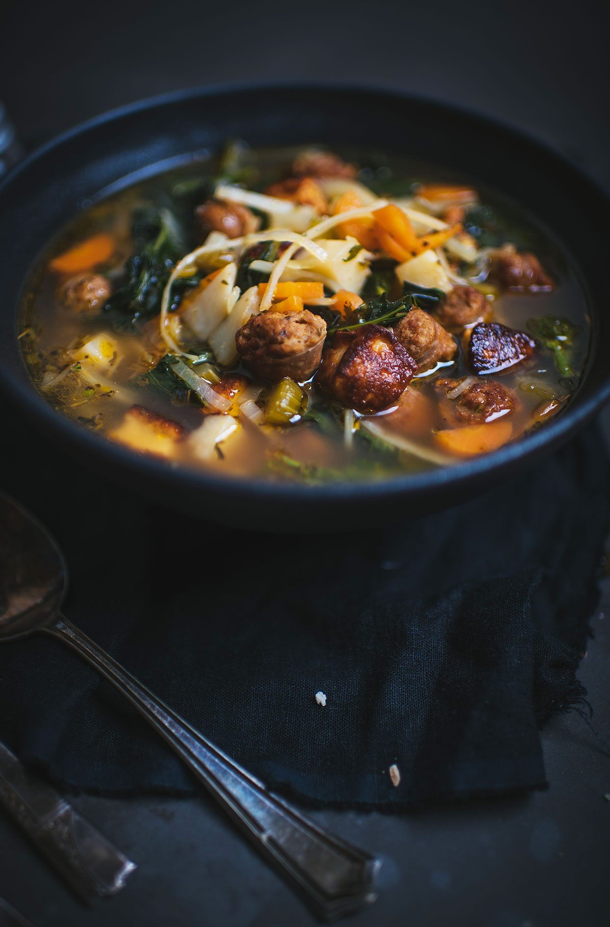 Deluxe soup with sausage, vegetables and grilled haloumi