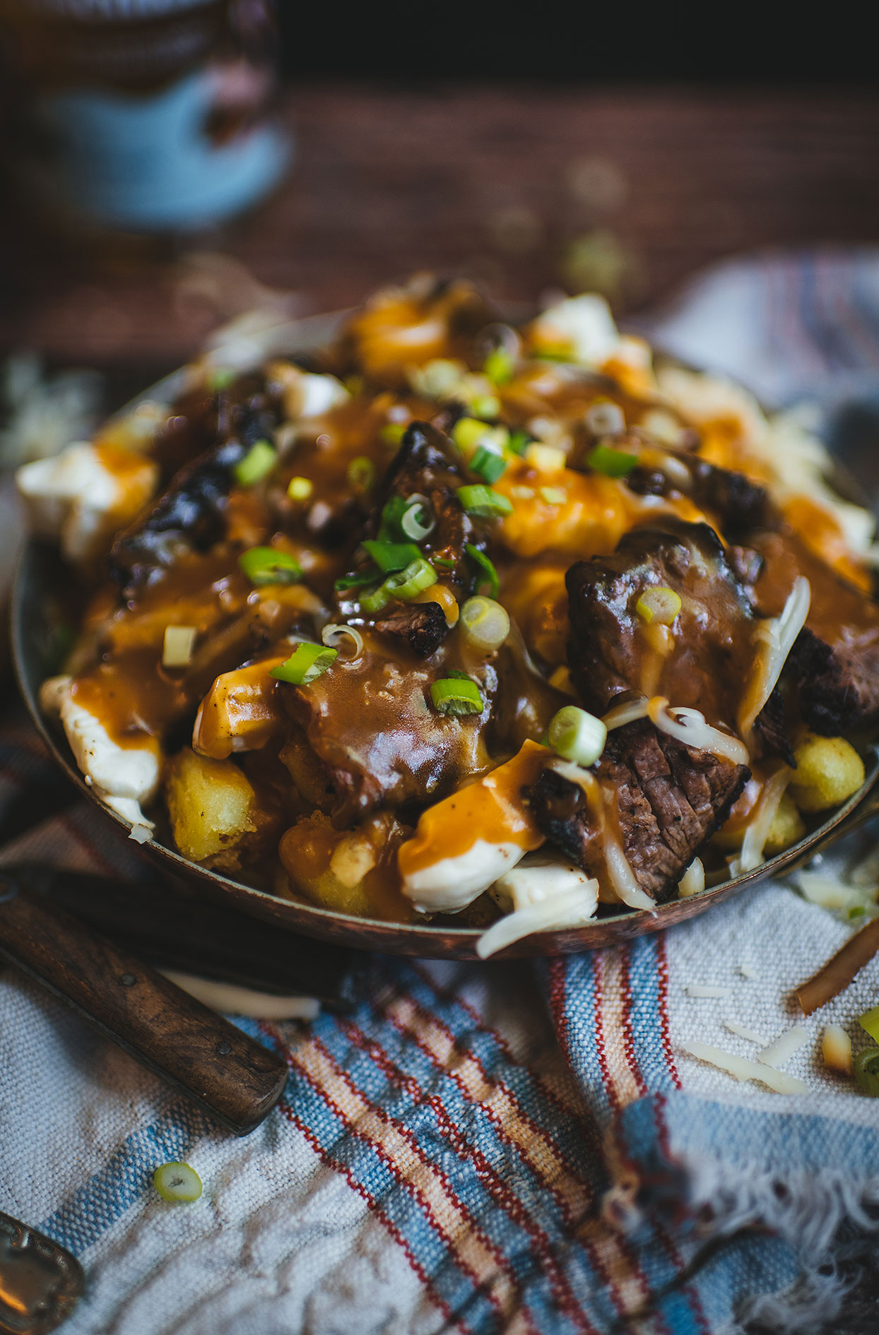 Gnocchi poutine with flank steak and rum sauce