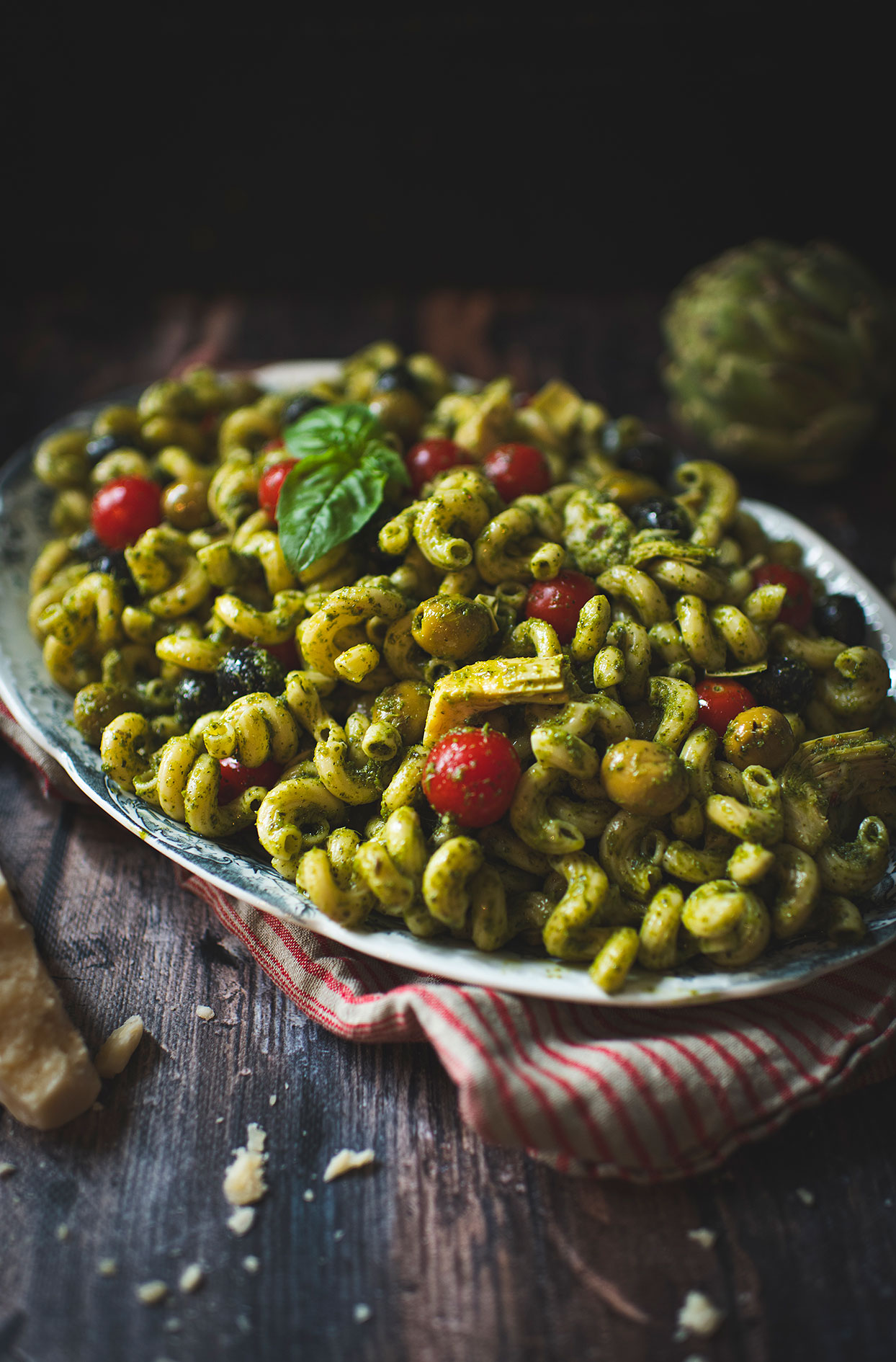 Pesto pasta salad with olives and artichoke hearts