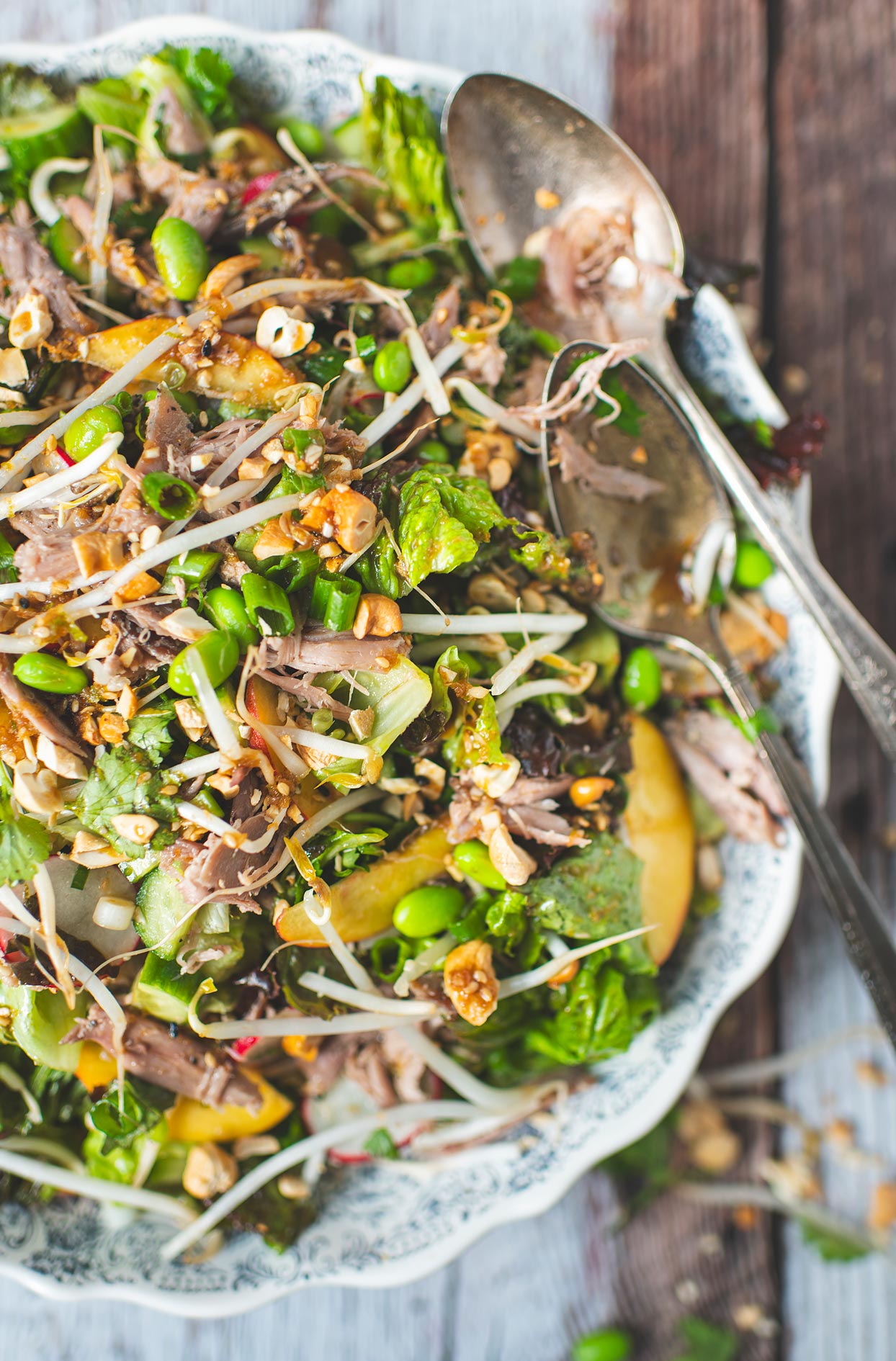 Asian salad with duck confit and peaches